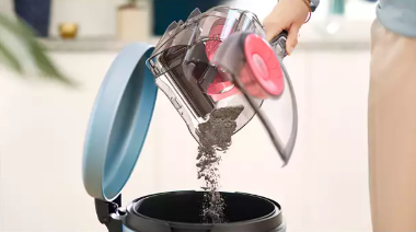 Dust container designed for hygienic one-handed emptying